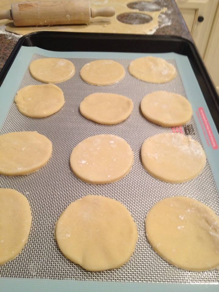 sugar cookies are sitting on a baking sheet 