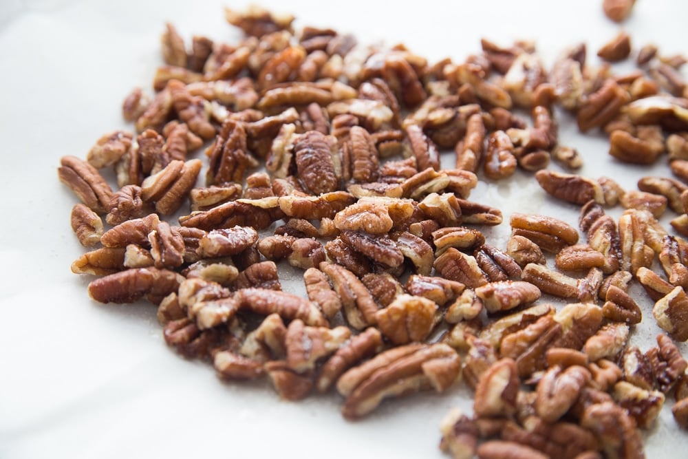 roasted pecans on parchment paper