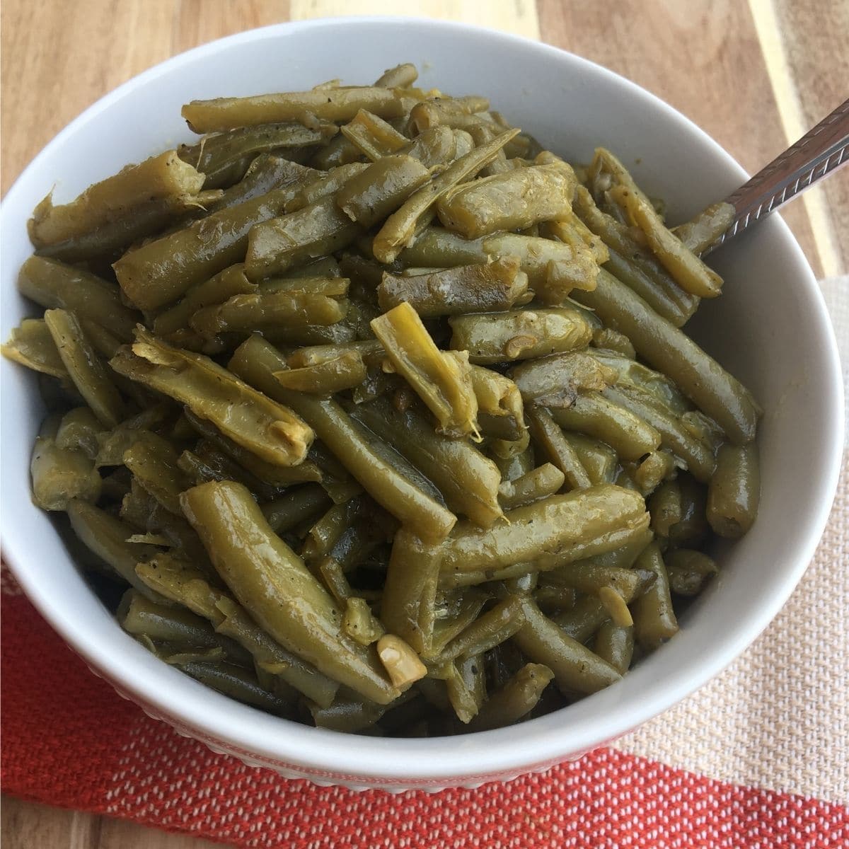 Bowl of finished southern style green beans with bacon