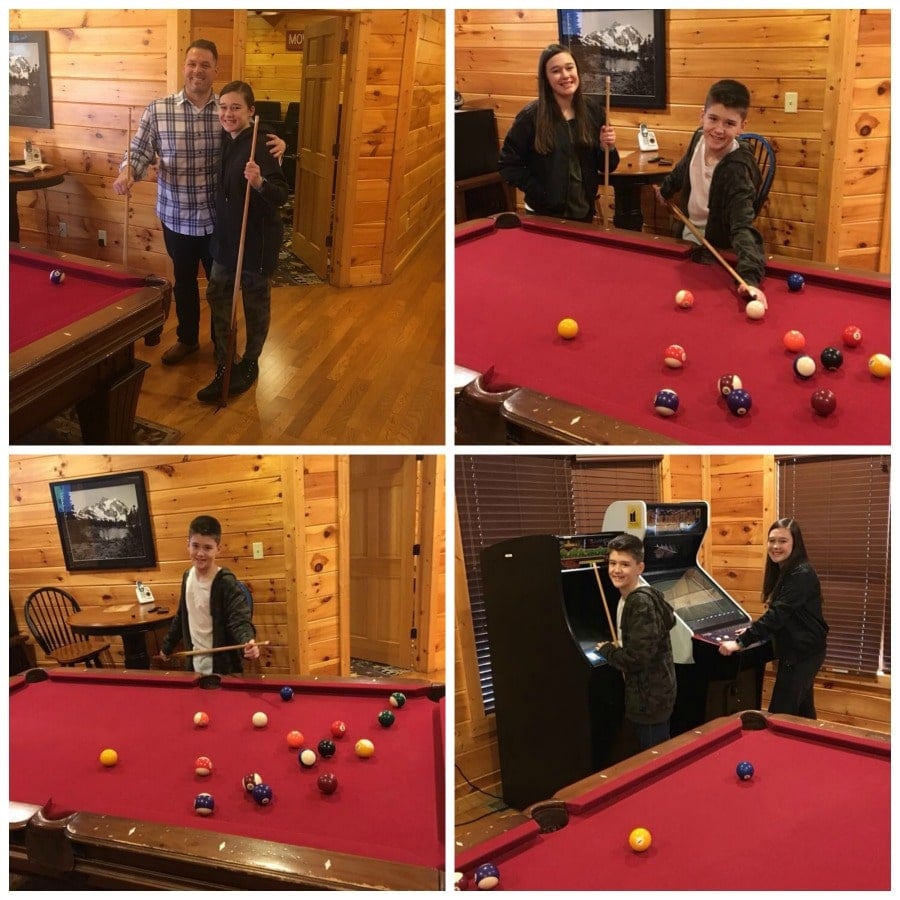 game room in a cabin family playing pool