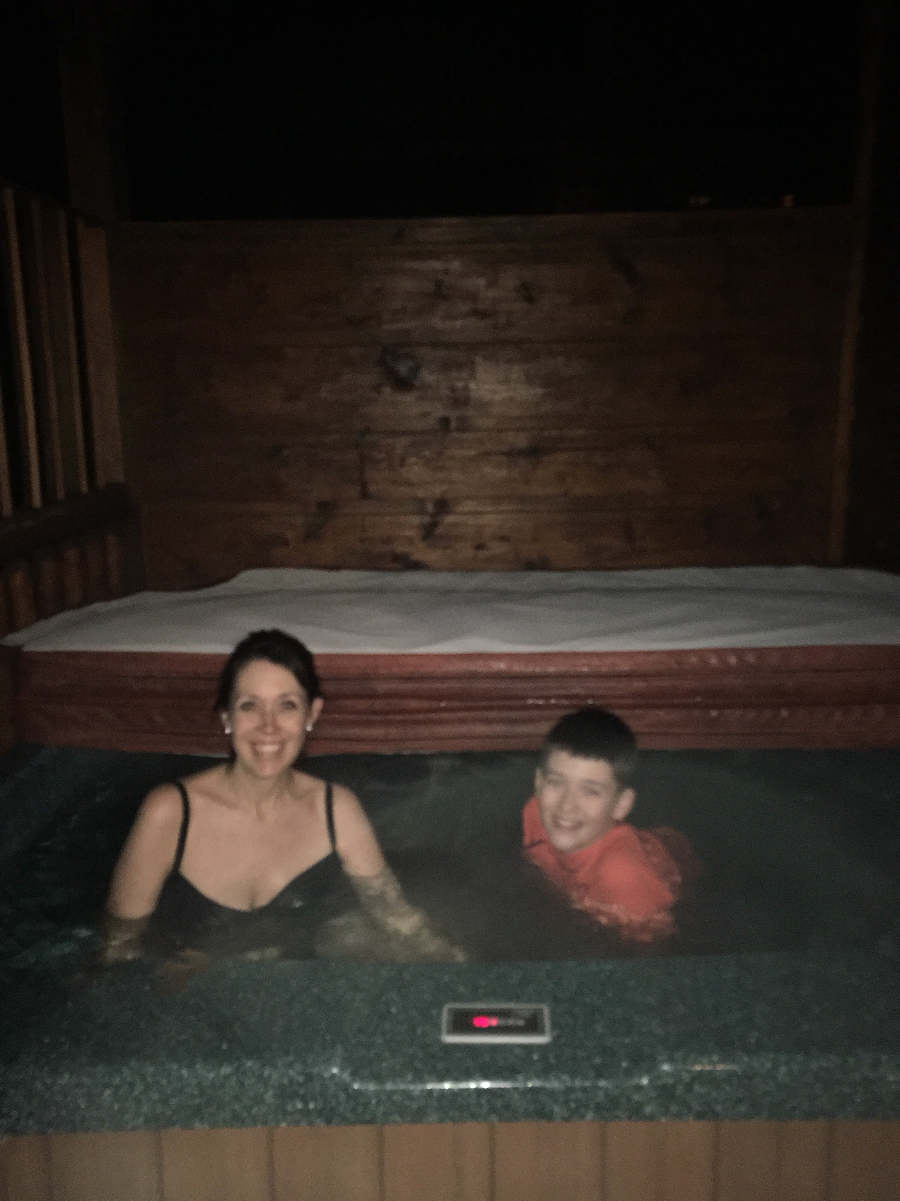 mom and son in hot tub