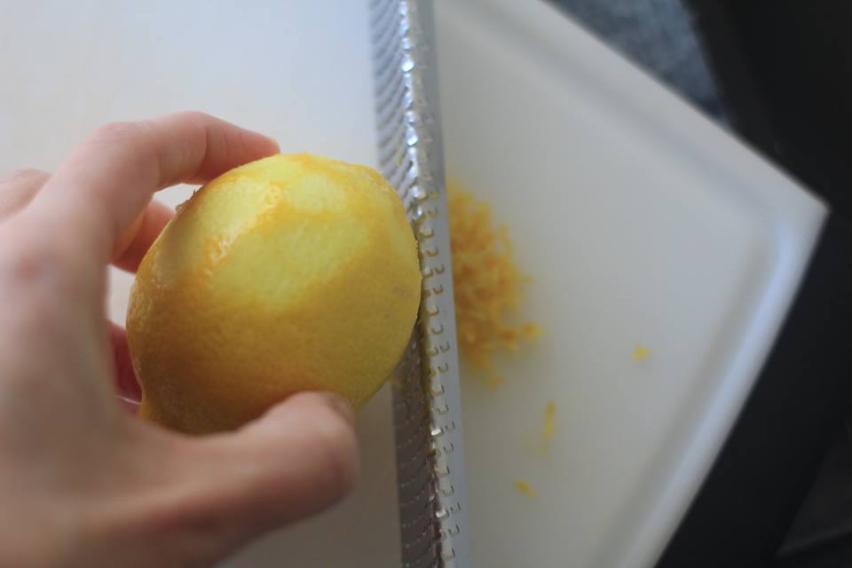 Lemon is zested by citrus zester