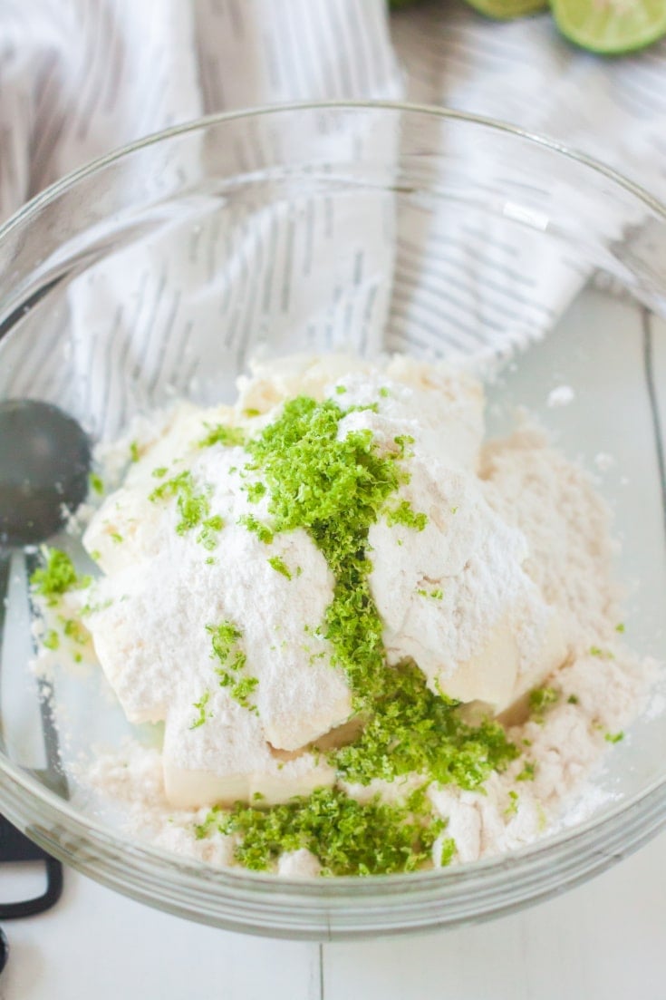 Cream cheese, keto sweetener, and key lime zest in a glass bowl 