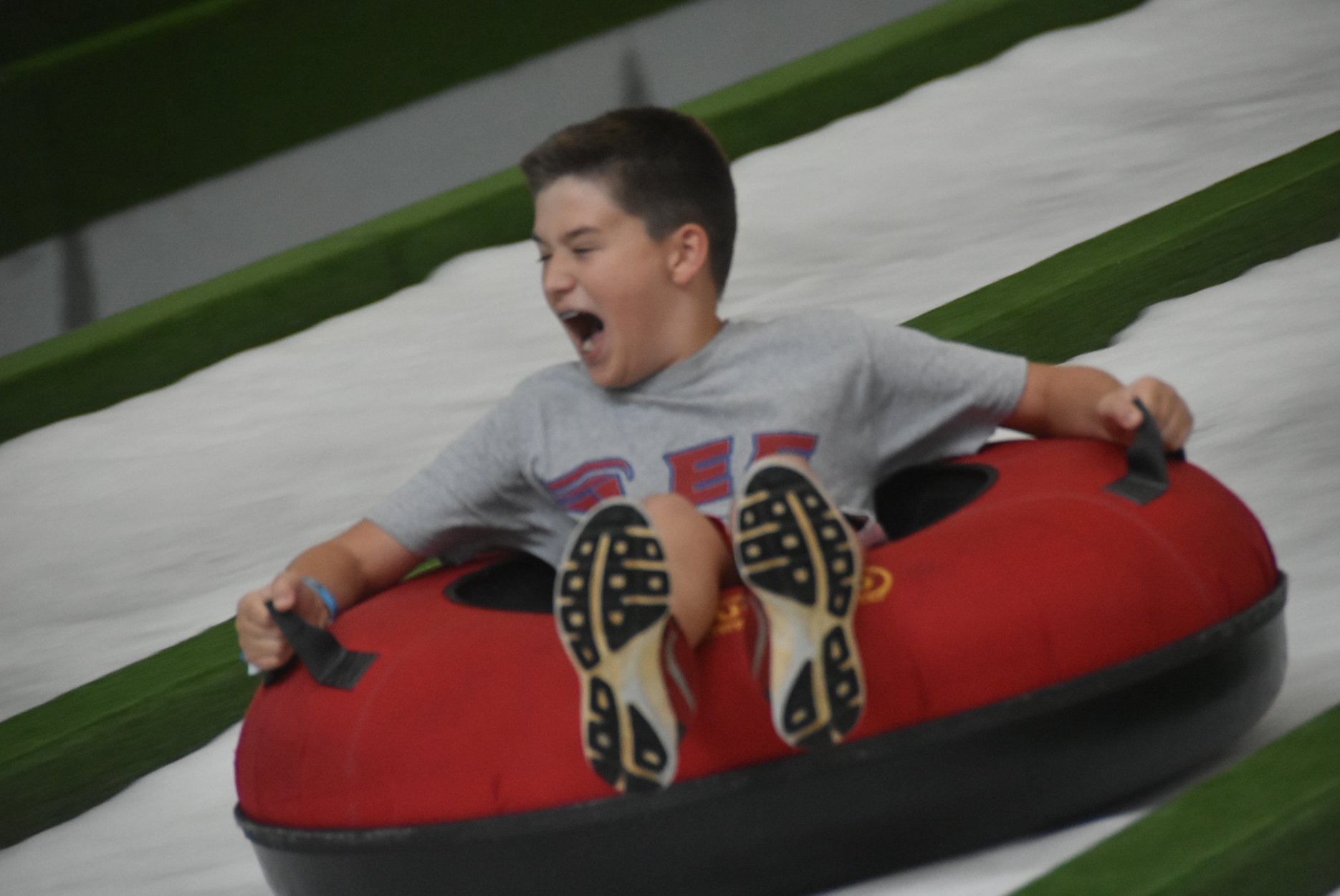 Pigeon Forge Snow boy tubing screaming with fun