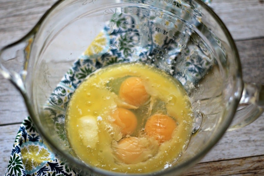 eggs and melted butter in a glass bowl. 
