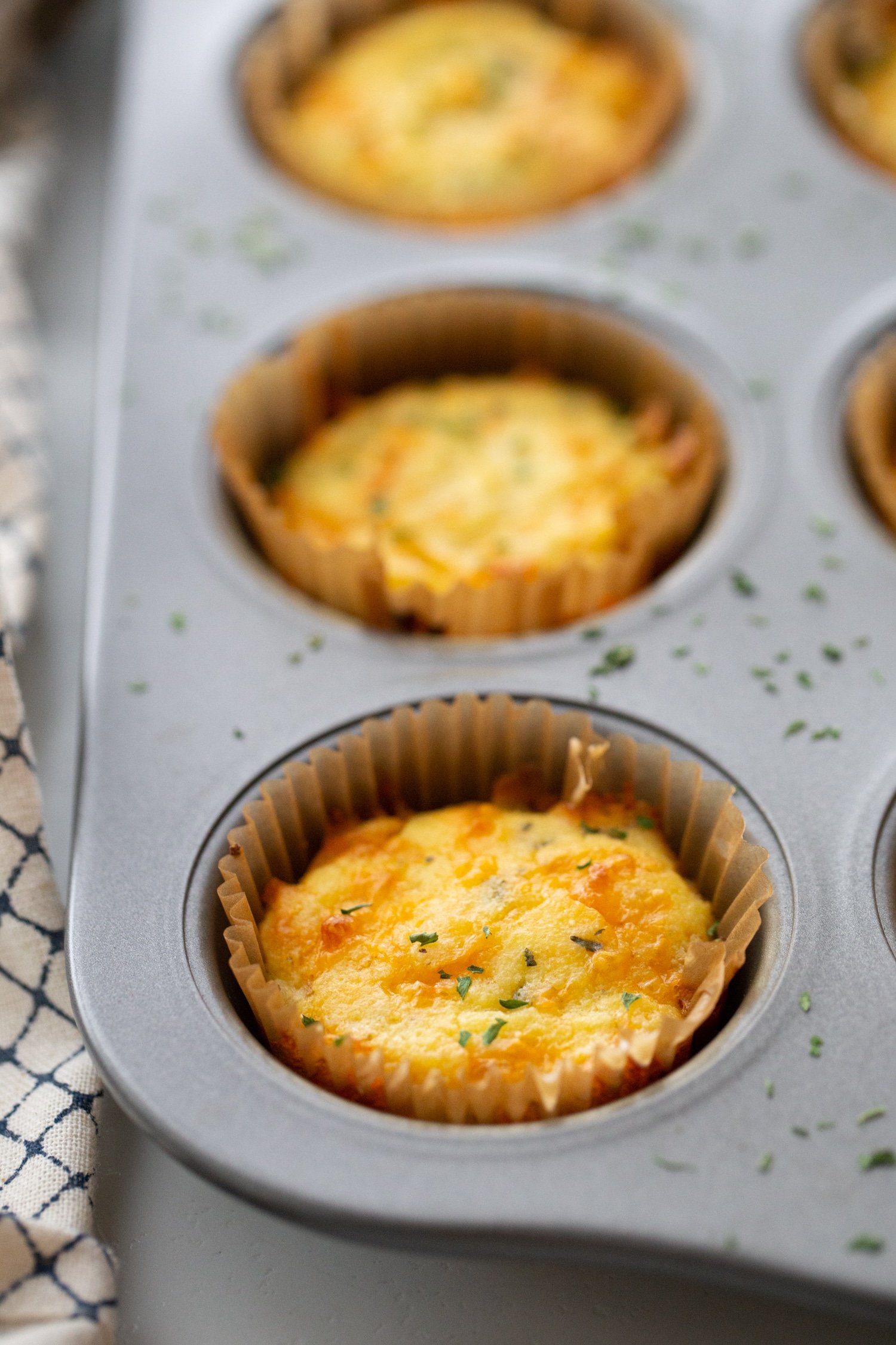 baked keto cheddar bay biscuits in muffin tins