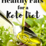 Close us of oil pouring in a spoon then falling onto a salad. The words Healthy Fat from a Keto Diet are towards the top of the image.