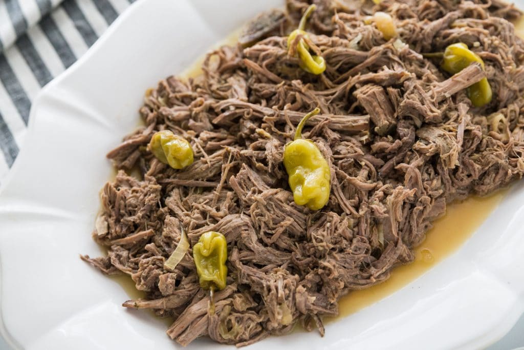 low carb pot roast slow cooker recipe plated on a white platter