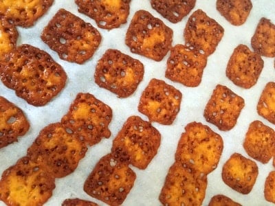 toasted cheese squares on parchment paper