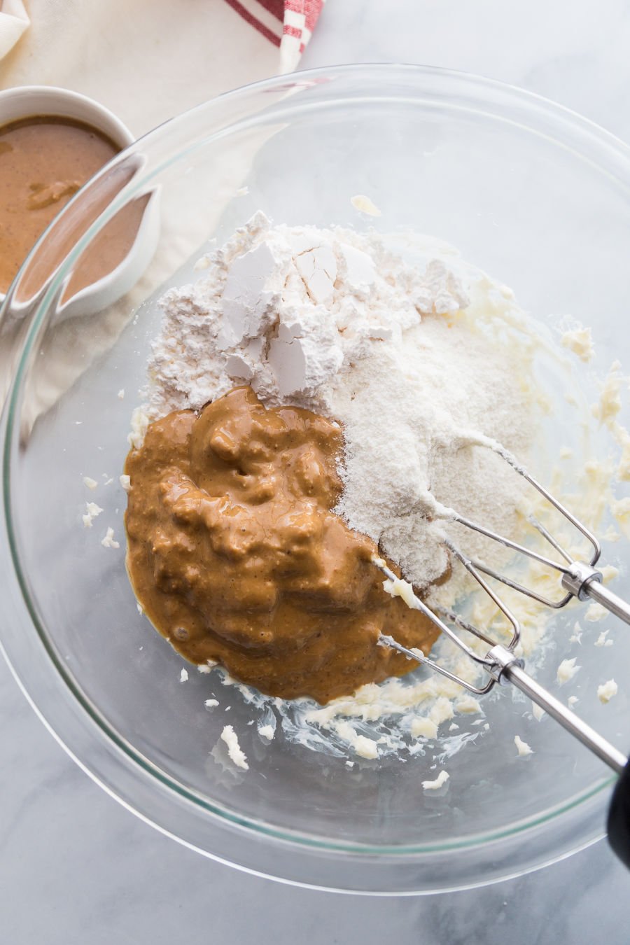 ingredients for first layer of peanut butter bars in a mixing bowl