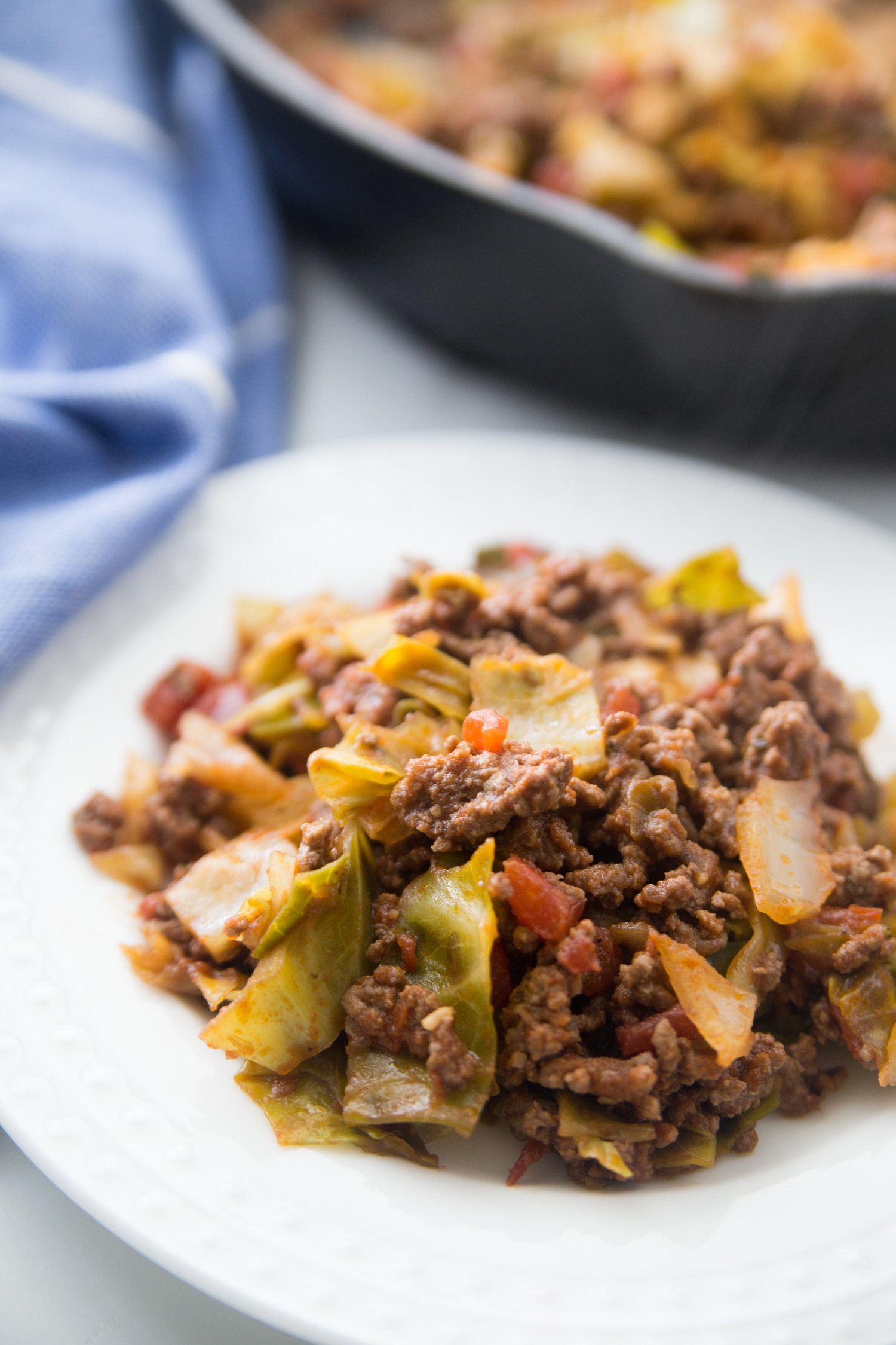 While bowl filled with keto unstuffed cabbage skillet recipe.