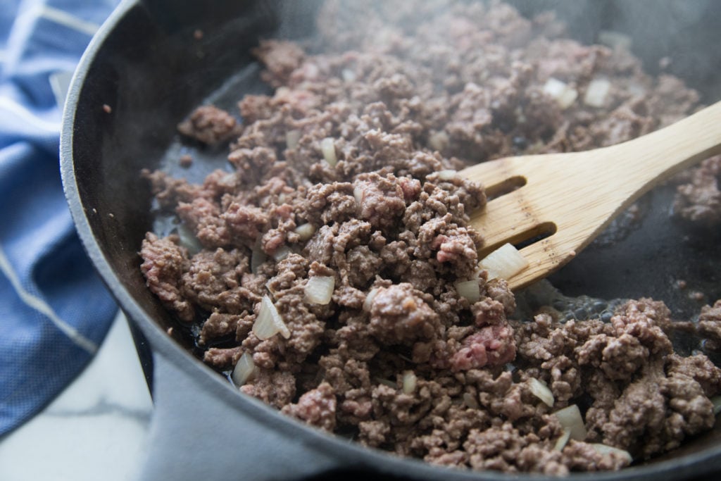 Ground beef browning in a cast iron skillet a low carb skillet meal