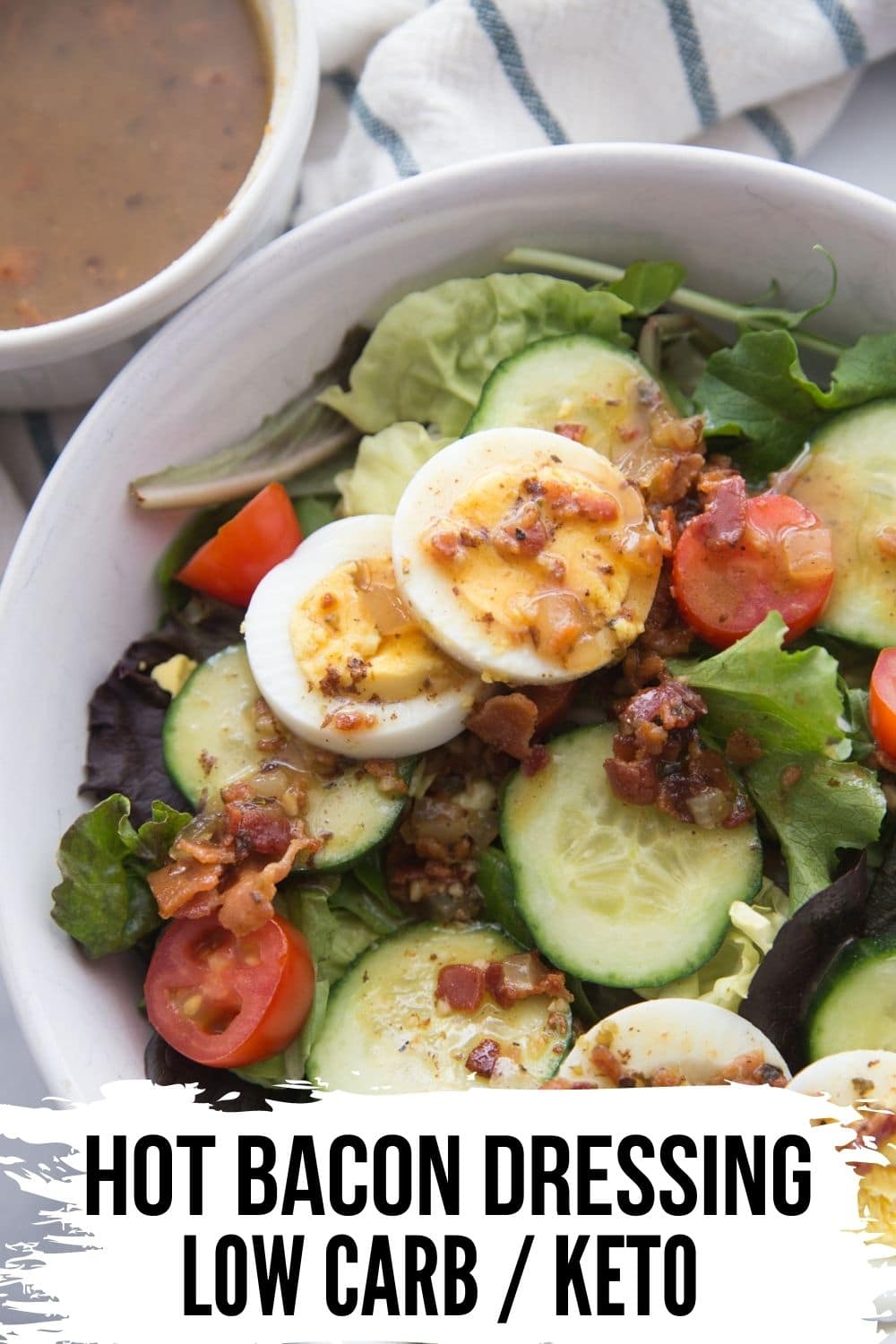 hot bacon keto dressing on a salad on a white bowl
