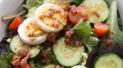 low carb hot bacon dressing on a salad