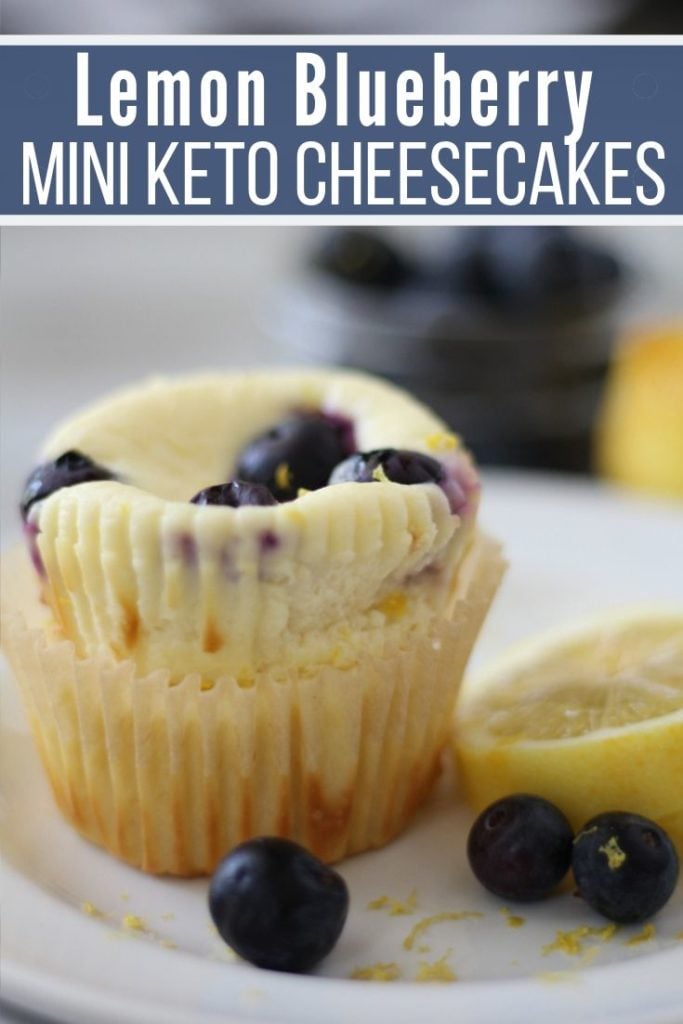 lemon blueberry mini keto cheesecakes plated with a slice of lemon and blueberries 
