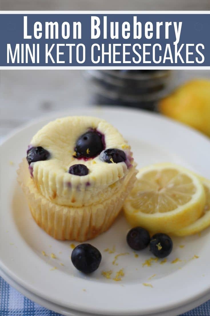 lemon blueberry mini keto cheesecakes plated with a slice of lemon and blueberries 