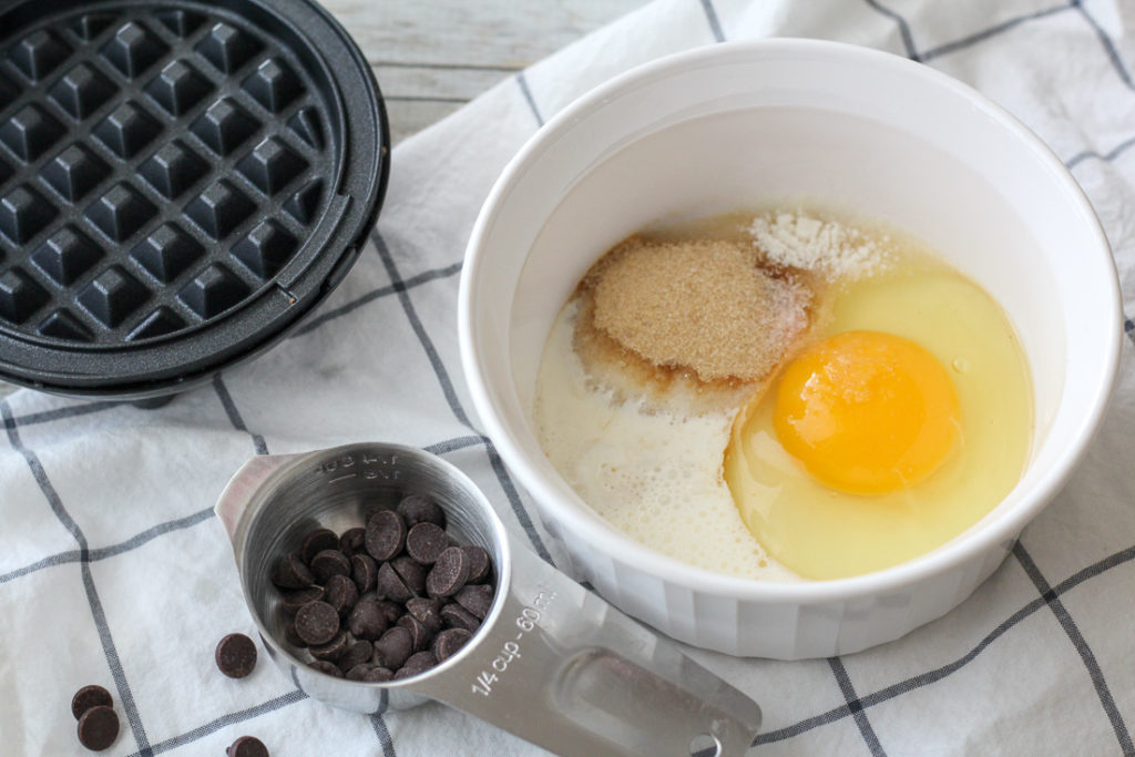 waffle maker, small bowl, and recipe ingredients for keto waffle