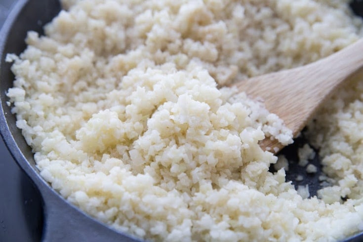 riced cauliflower fried in butter in a cast iron skillet to serve with pot roast crock-pot recipe