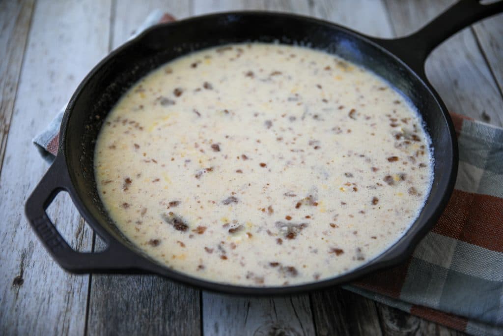 quiche mixture in a cast iron skillet before baking