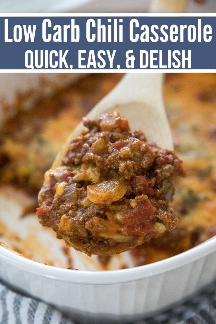 low carb chili casserole in the background with a serving on a wooden spoon in the front