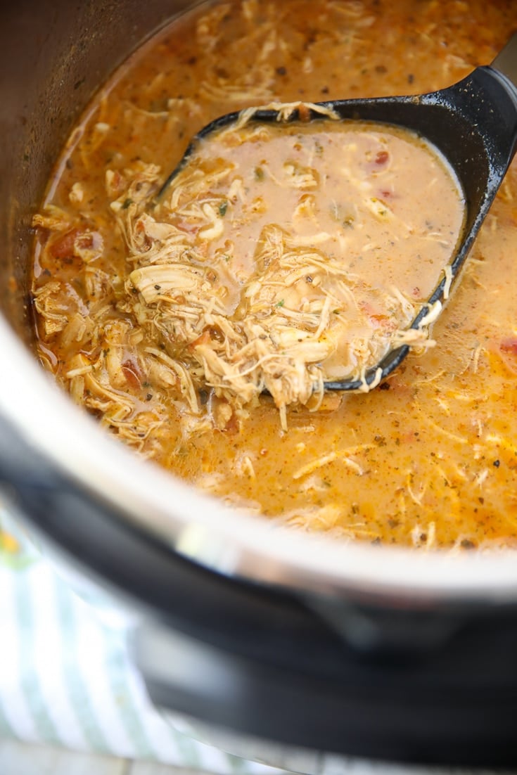 keto chicken taco soup in the instant pot with a serving on a dipper