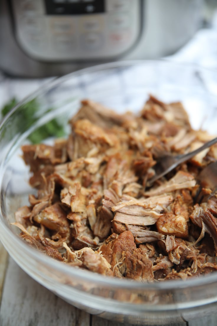pork roast out of the instant pot in a bowl ready to shred