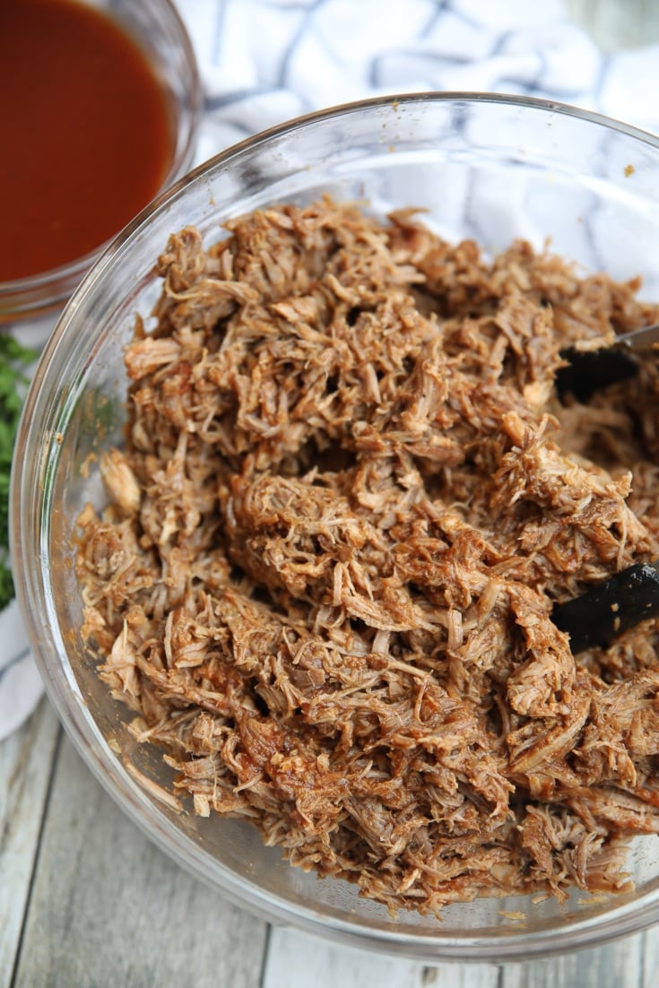 low carb pulled pork in a glass bowl with sugar-free bbq sauce