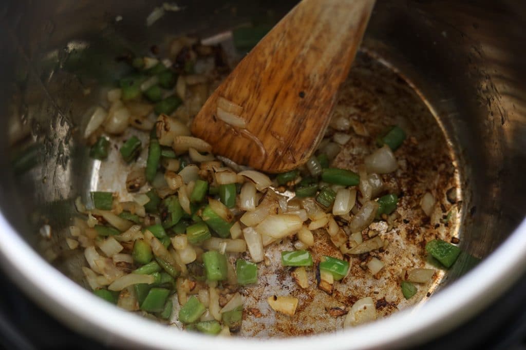 saute green peppers onions and garlic in the instant pot