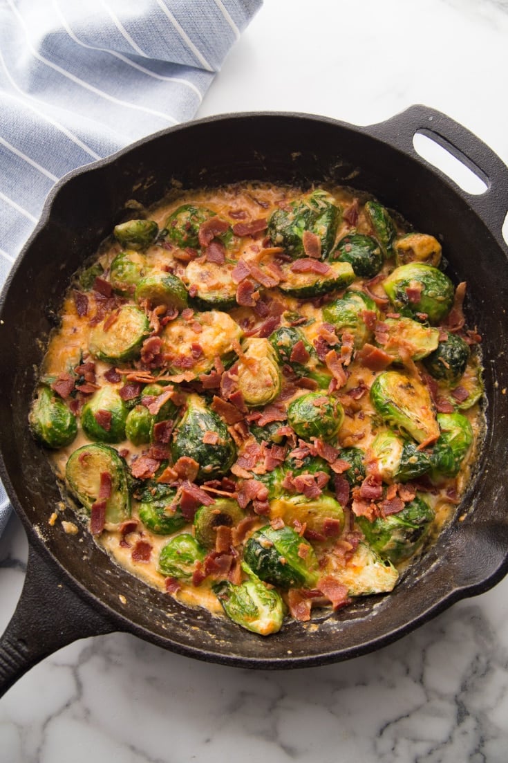 Keto Brussels sprouts out of the oven in a cast iron skillet