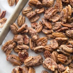 keto candied pecans on a cookie sheet