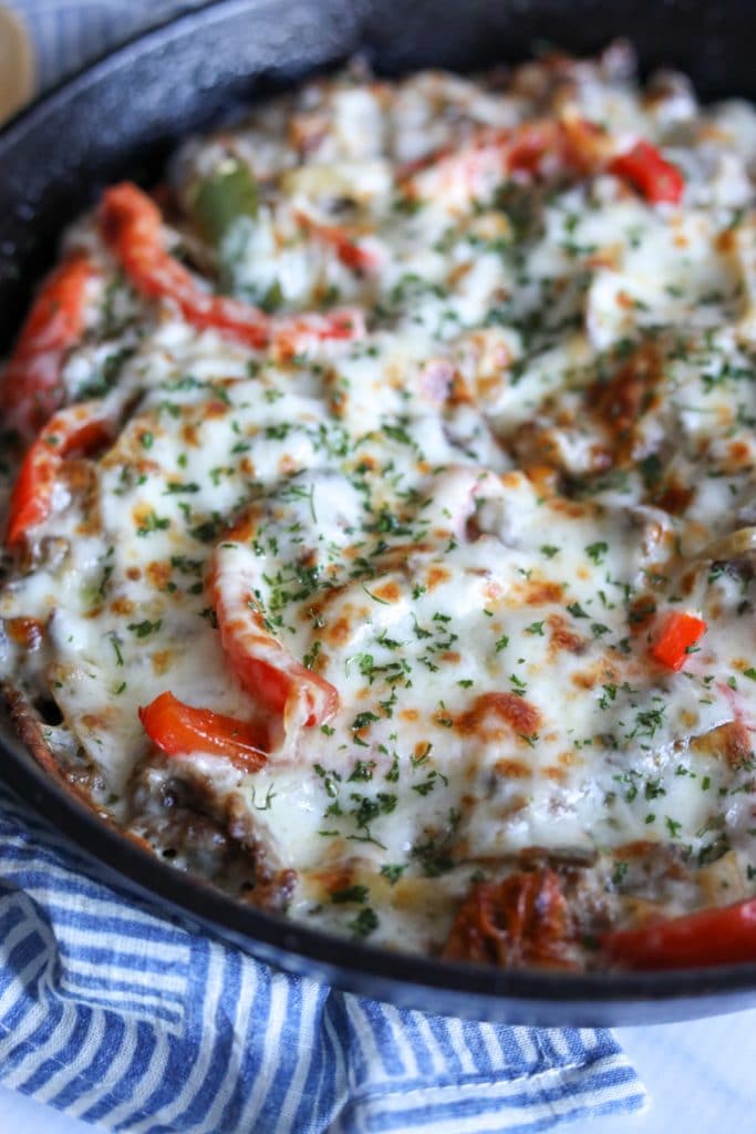 Philly cheesesteak casserole in a cast iron skillet