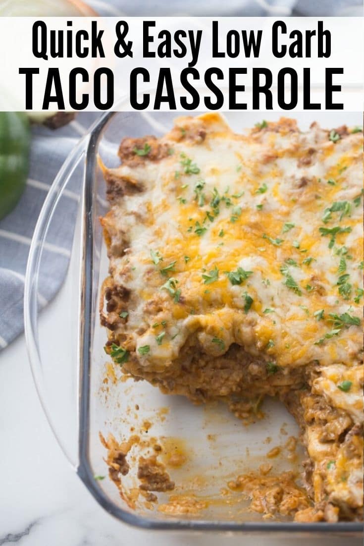 Cheesy beef casserole in a clear casserole dish with a slice cut out.