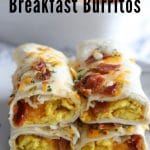 breakfast burritos stacked on top of one another with eggs, cheese and bacon