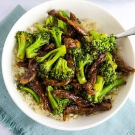 beef & broccoli stir fry in white bowl