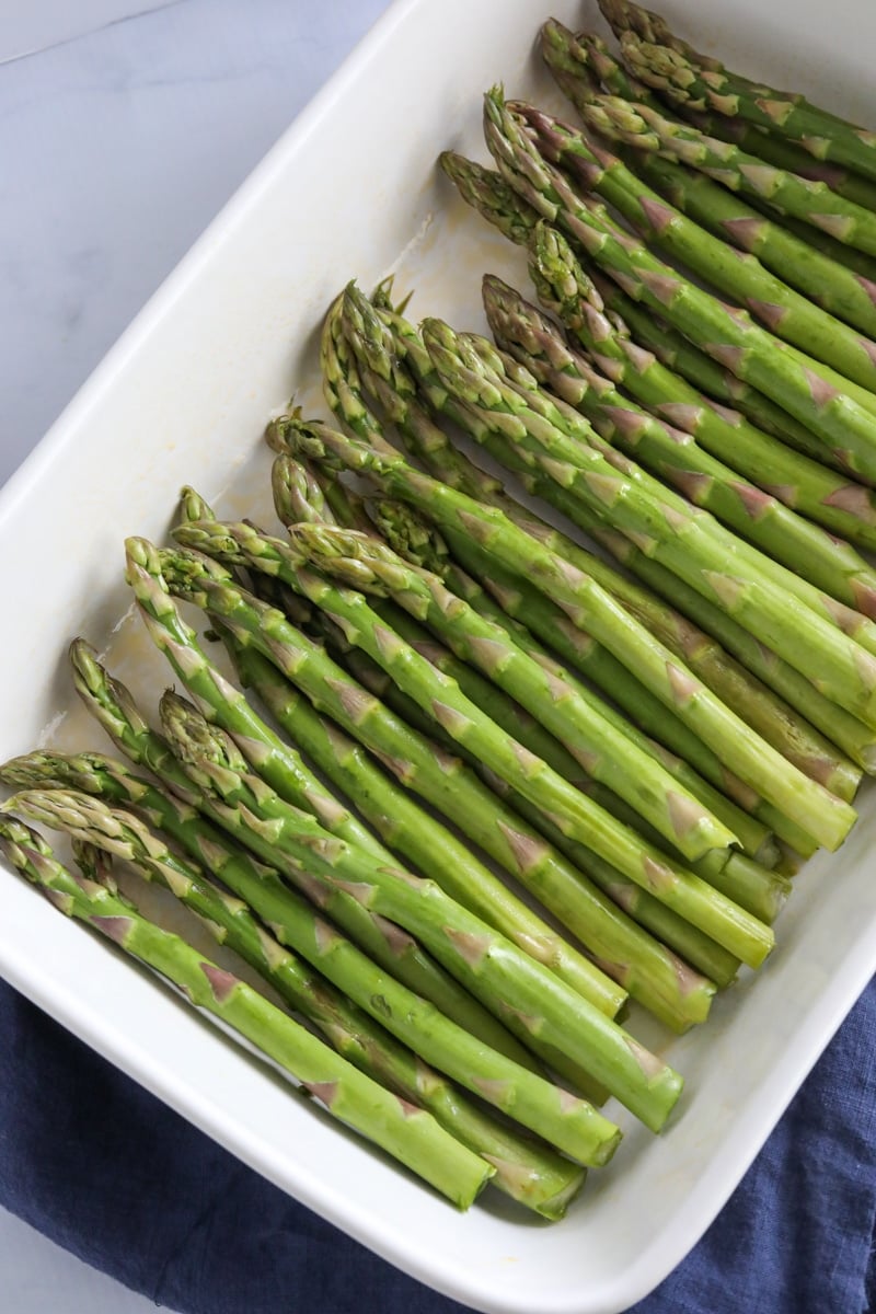 Asparagus in a white pan.