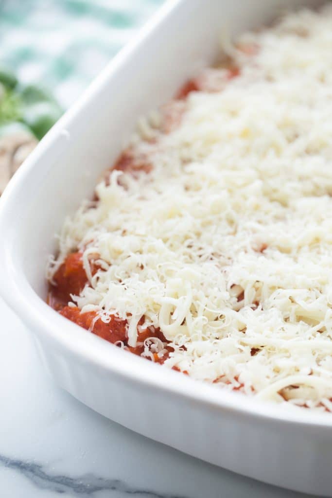 chicken tomato sauce and cheese layered in a casserole dish