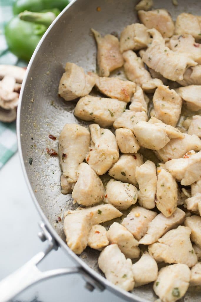 seared chicken cubes in a skillet