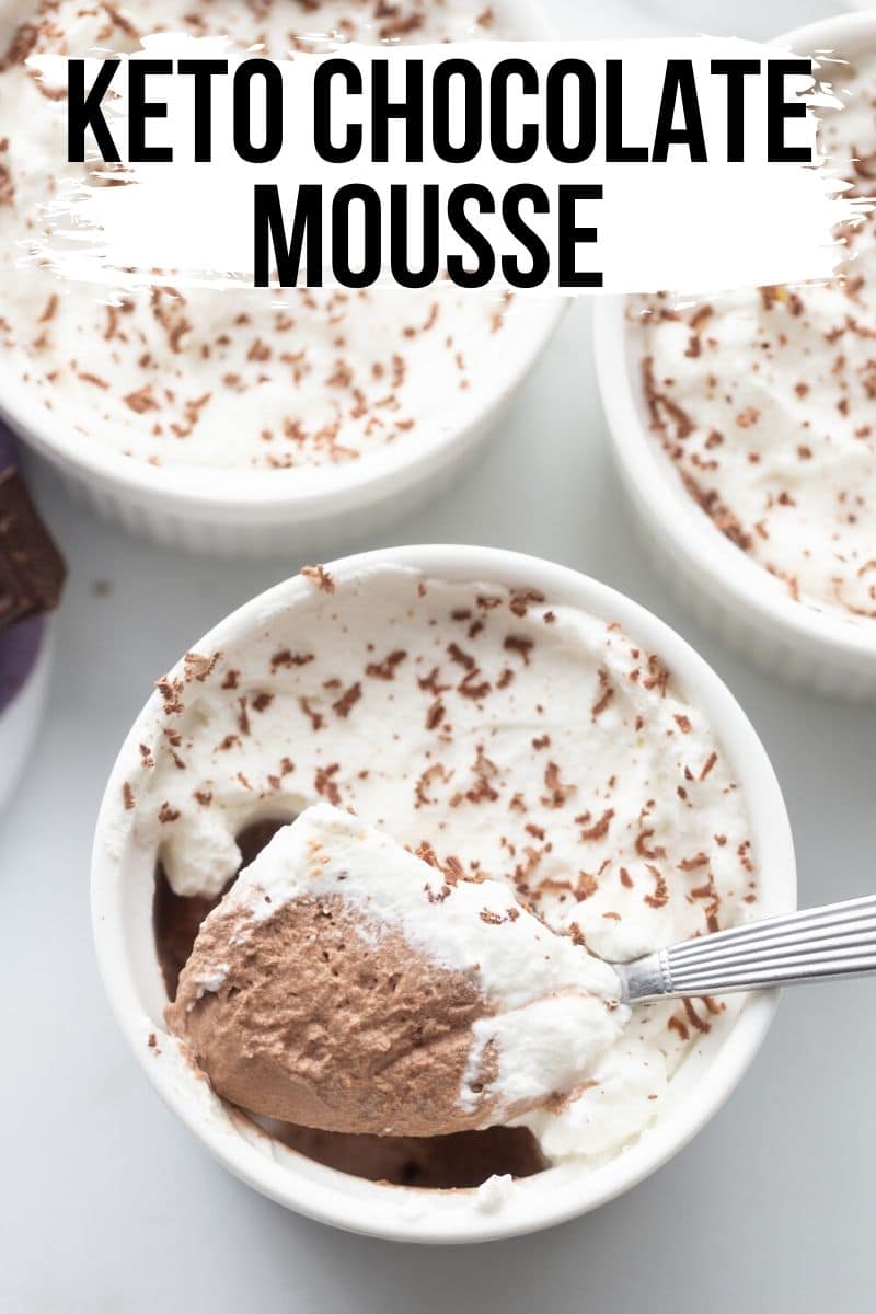 Keto Chocolate Mousse with whipped cream in a ramekin.
