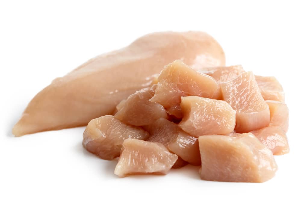raw chicken breasts cut into nuggets