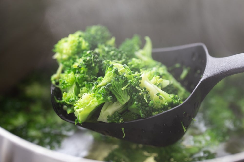blanched broccoli in a ladel