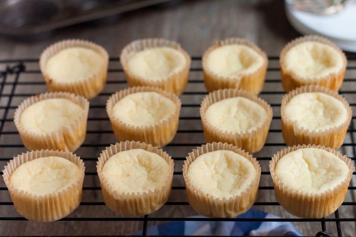 baked mini keto cheesecakes on a cooling rack