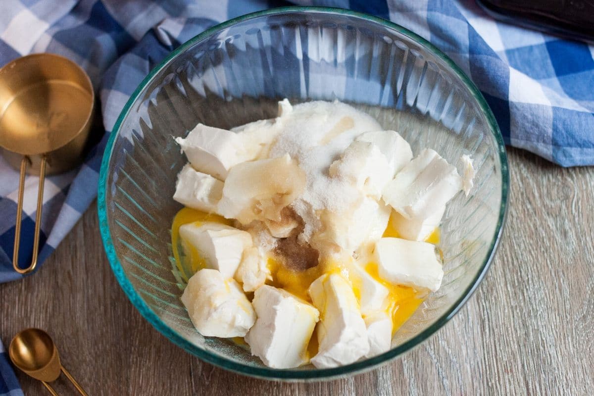 cream cheese, sugar substitute, eggs and vanilla extract in a clear bowl