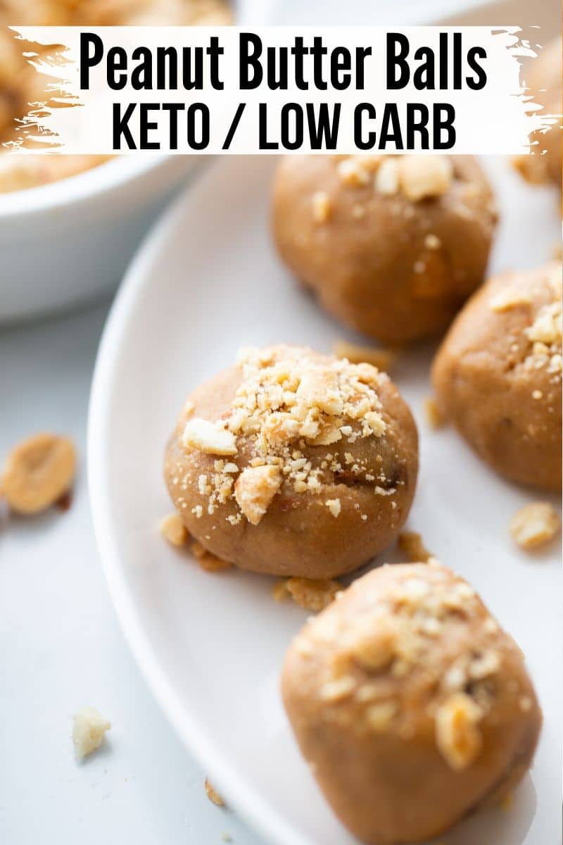 no bake peanut butter protein balls on a white plate with crushed peanuts on top
