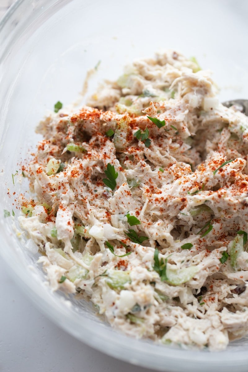 low carb chicken salad in clear bowl with paprika on top