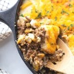 shepherds pie with ground beef and cheese in a skillet