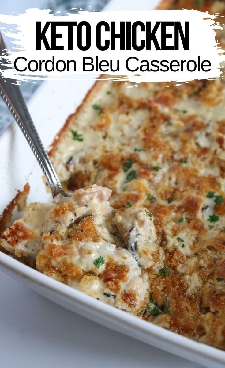 chicken cordon blue casserole in a white baking dish with a spoon