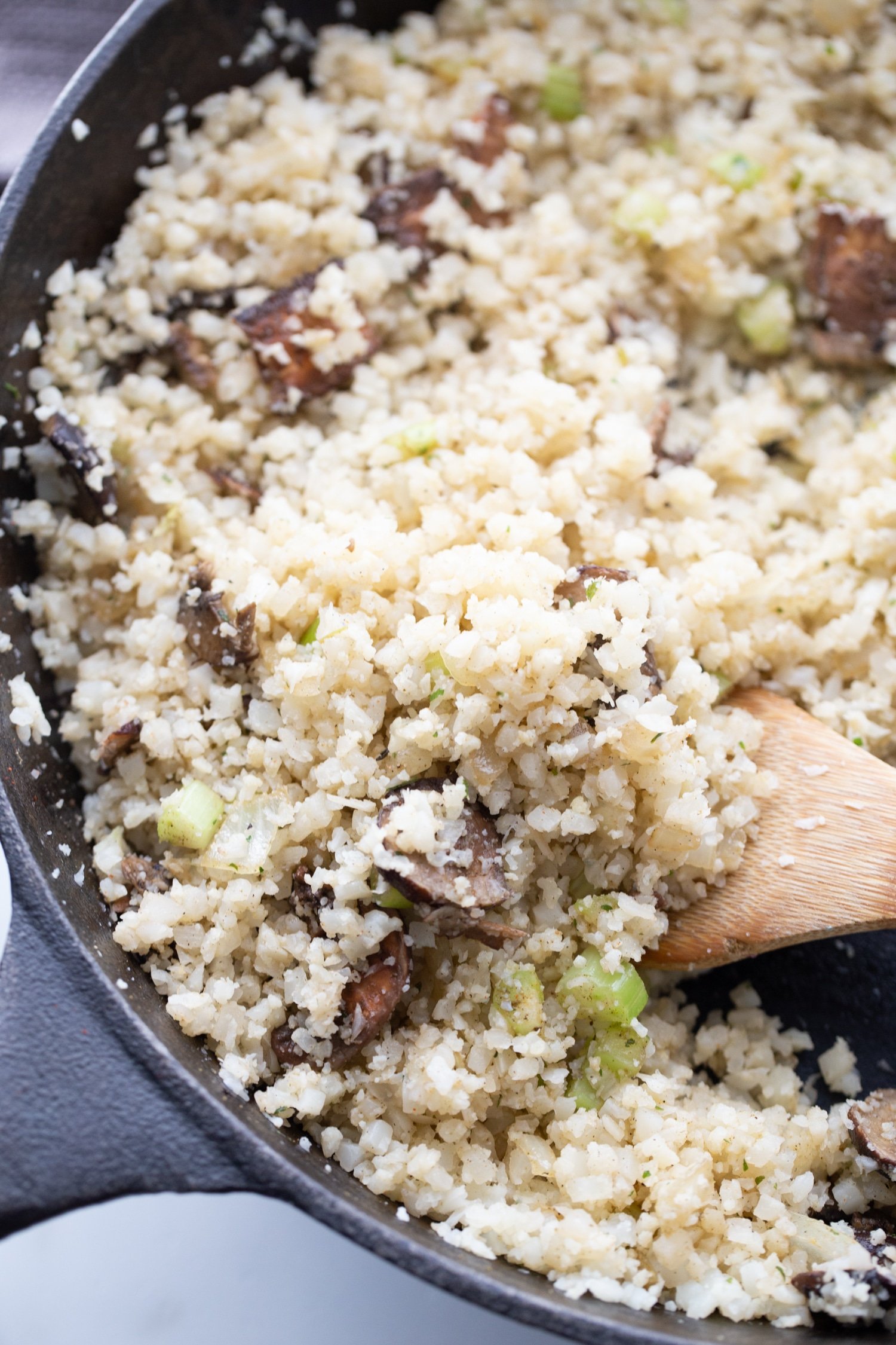 riced cauliflower in a skillet with mushrooms