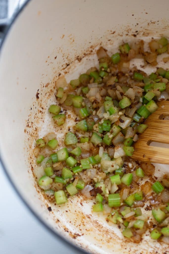 celery, onion and garlic simmering in a dutch oven