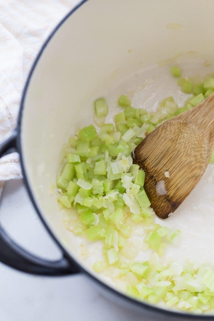 cooking the celery and onions in the dutch oven
