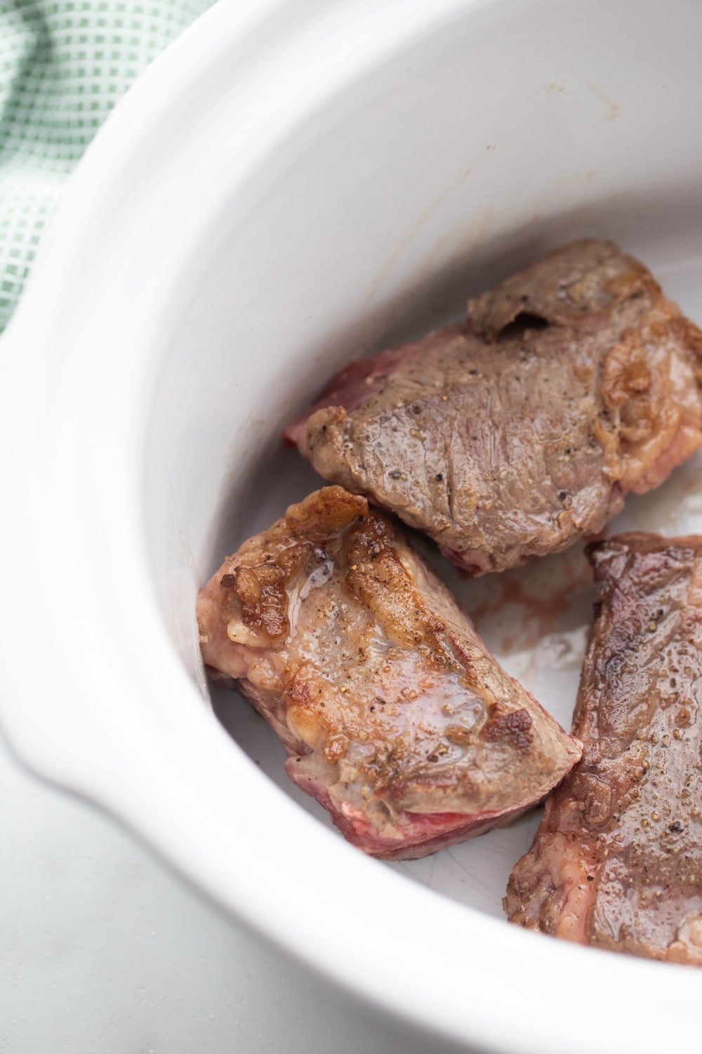 browned short ribs in a crock-pot